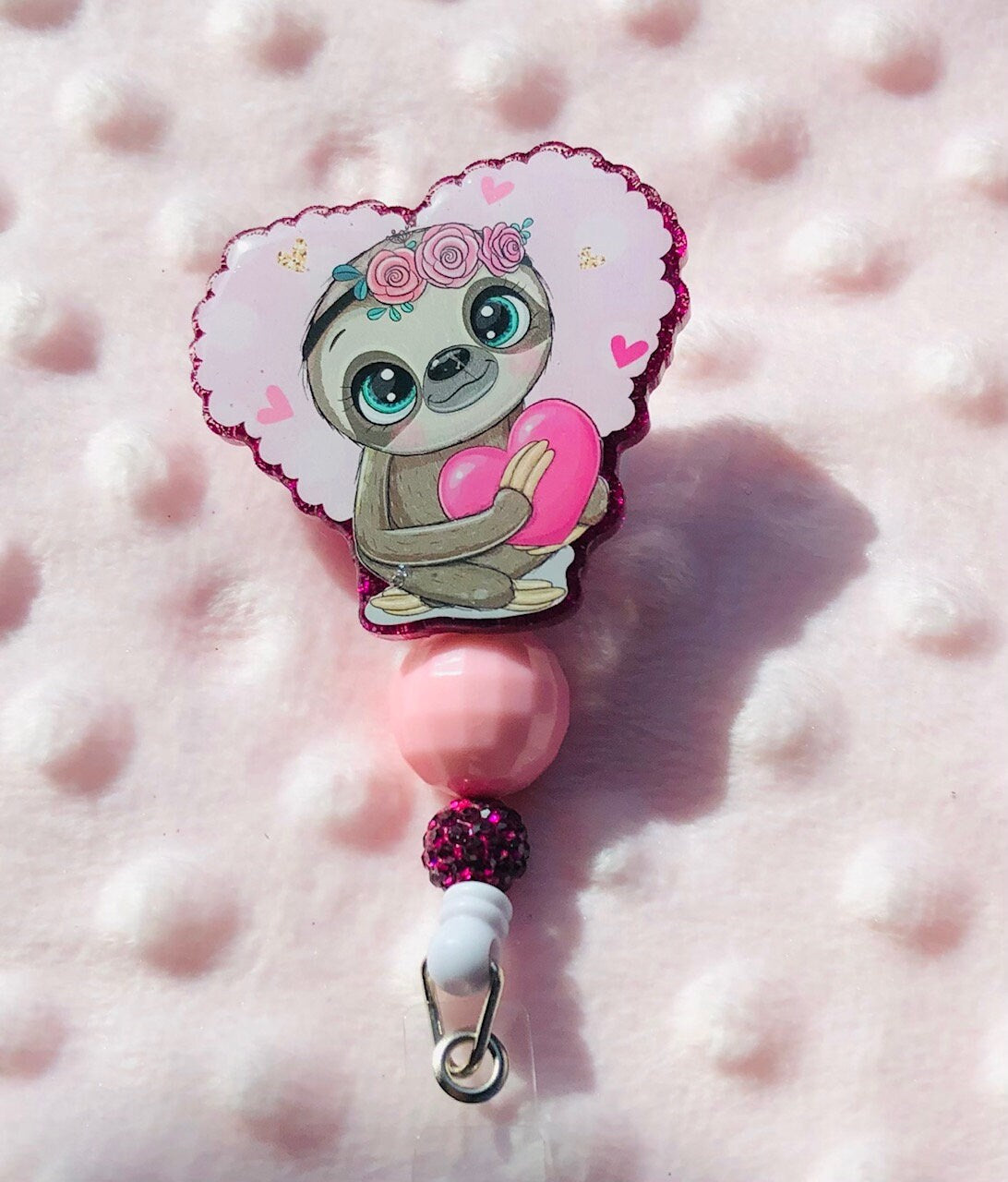 Cute Sloth holding a heart - retractable Badge Reel with Alligator Clip. Great for anyone required to wear a badge