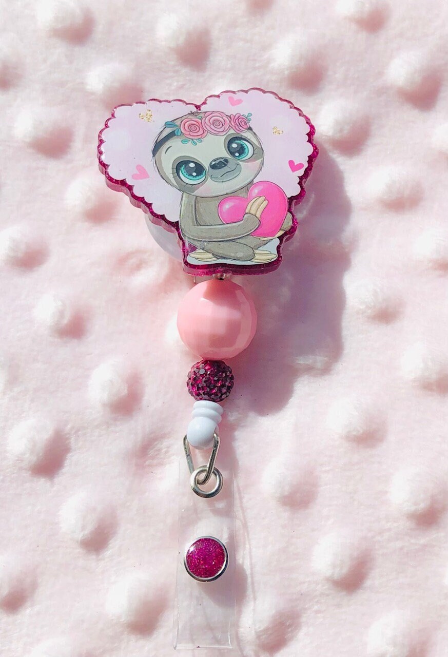 Cute Sloth holding a heart - retractable Badge Reel with Alligator Clip. Great for anyone required to wear a badge